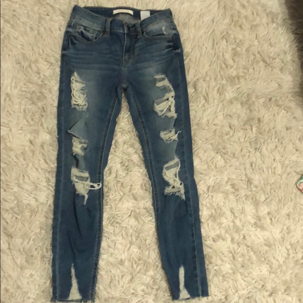 low rises medium washed blue ripped jeans